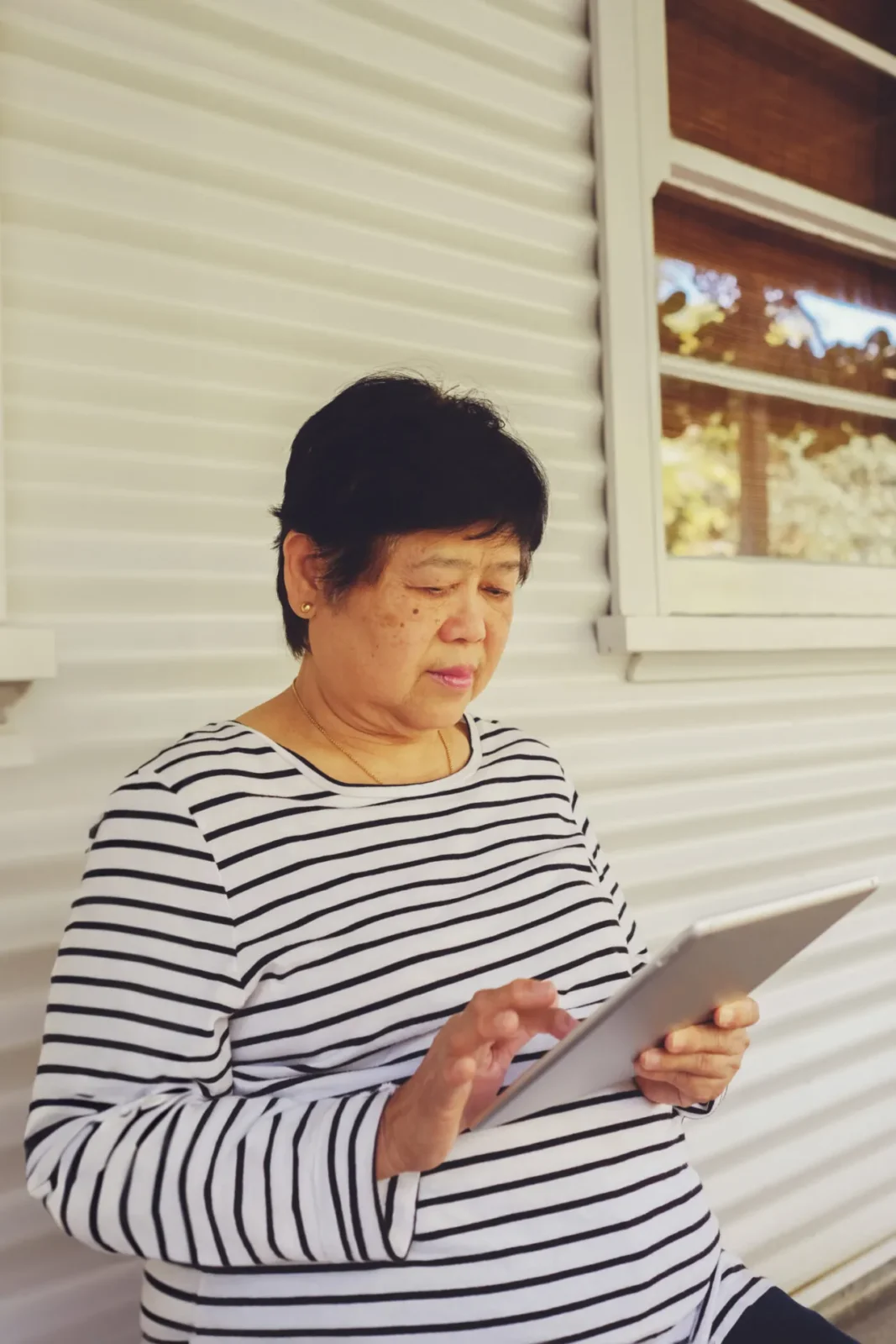 elderly client using an ipad