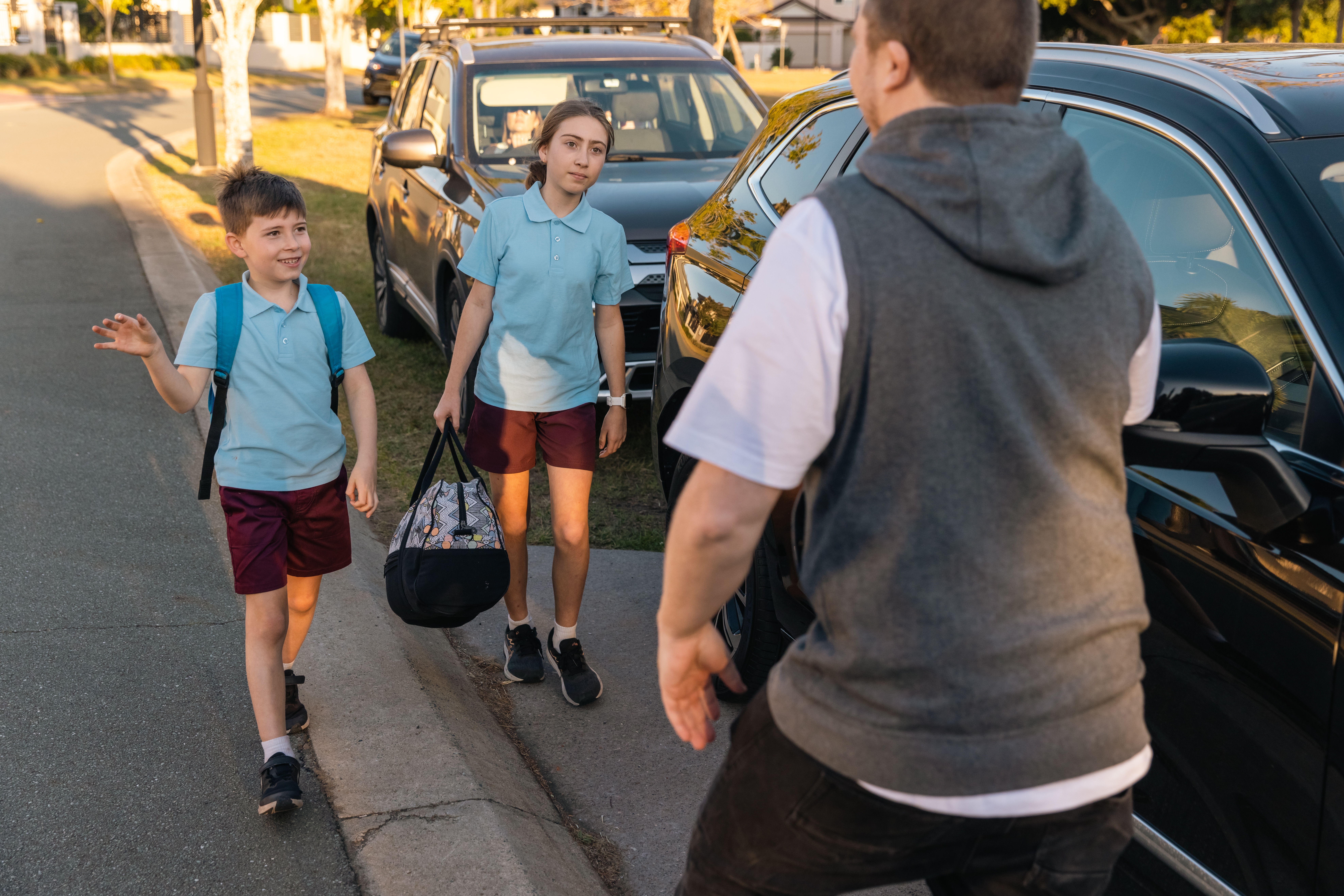 Parenting with your ex-partner. Father picking up children from ex-partner.