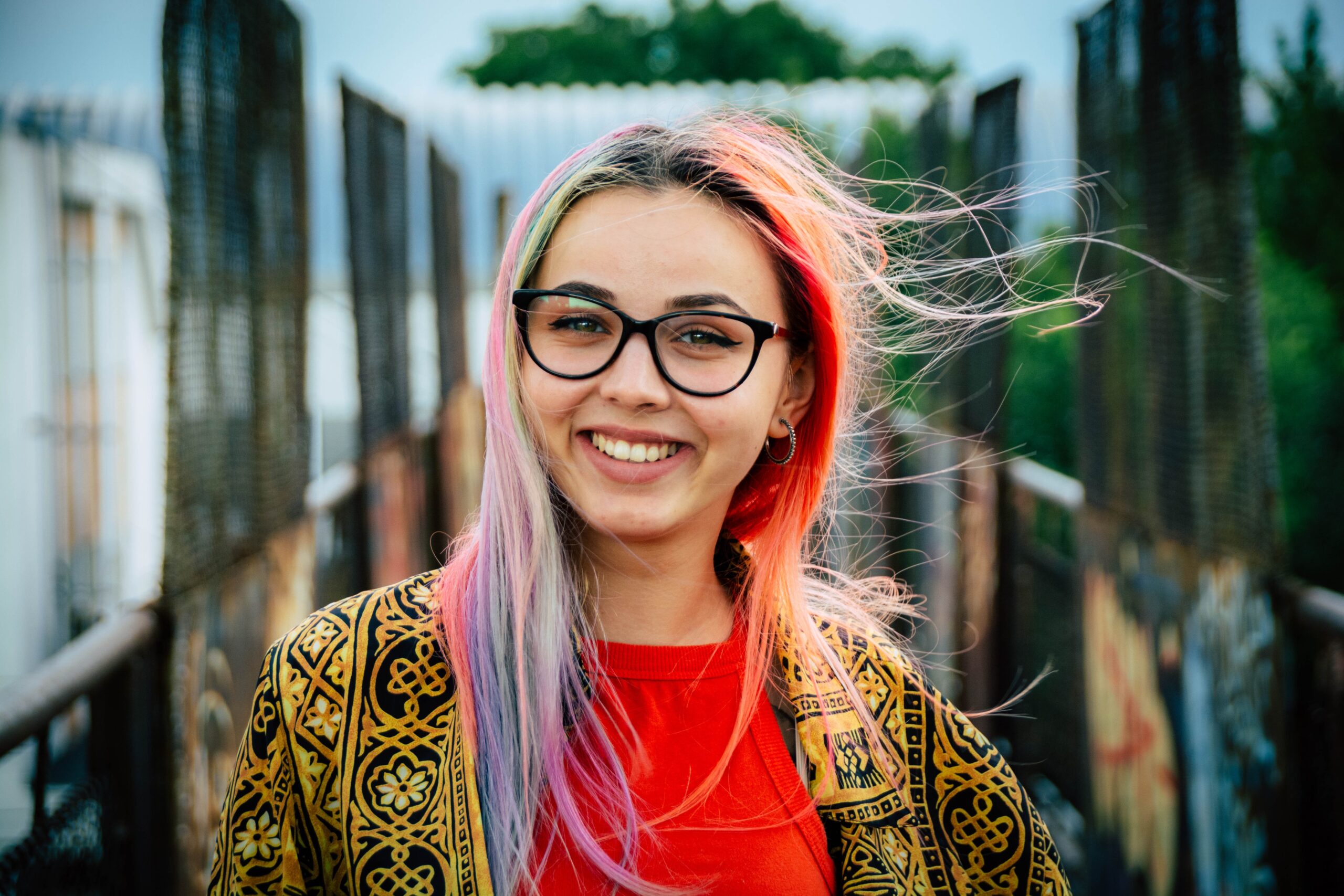 Foster child turns 18. Image of young woman smiling at camera.