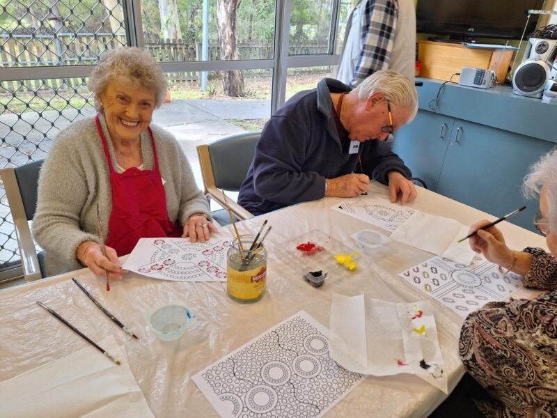 Aged care clients doing Aboriginal art