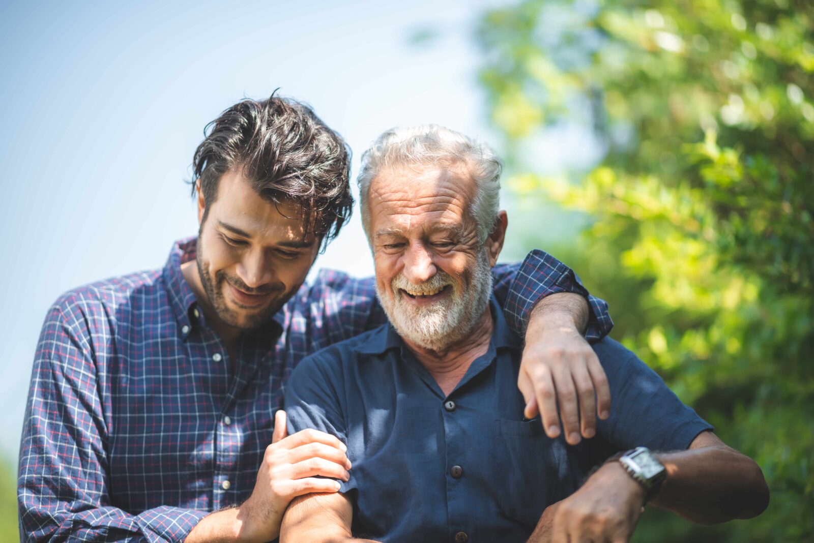 Son and Father laughing while walking outside
