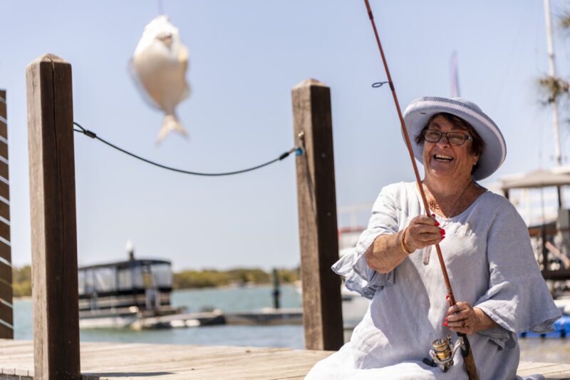 Older lady fishing, receiving person-centred care