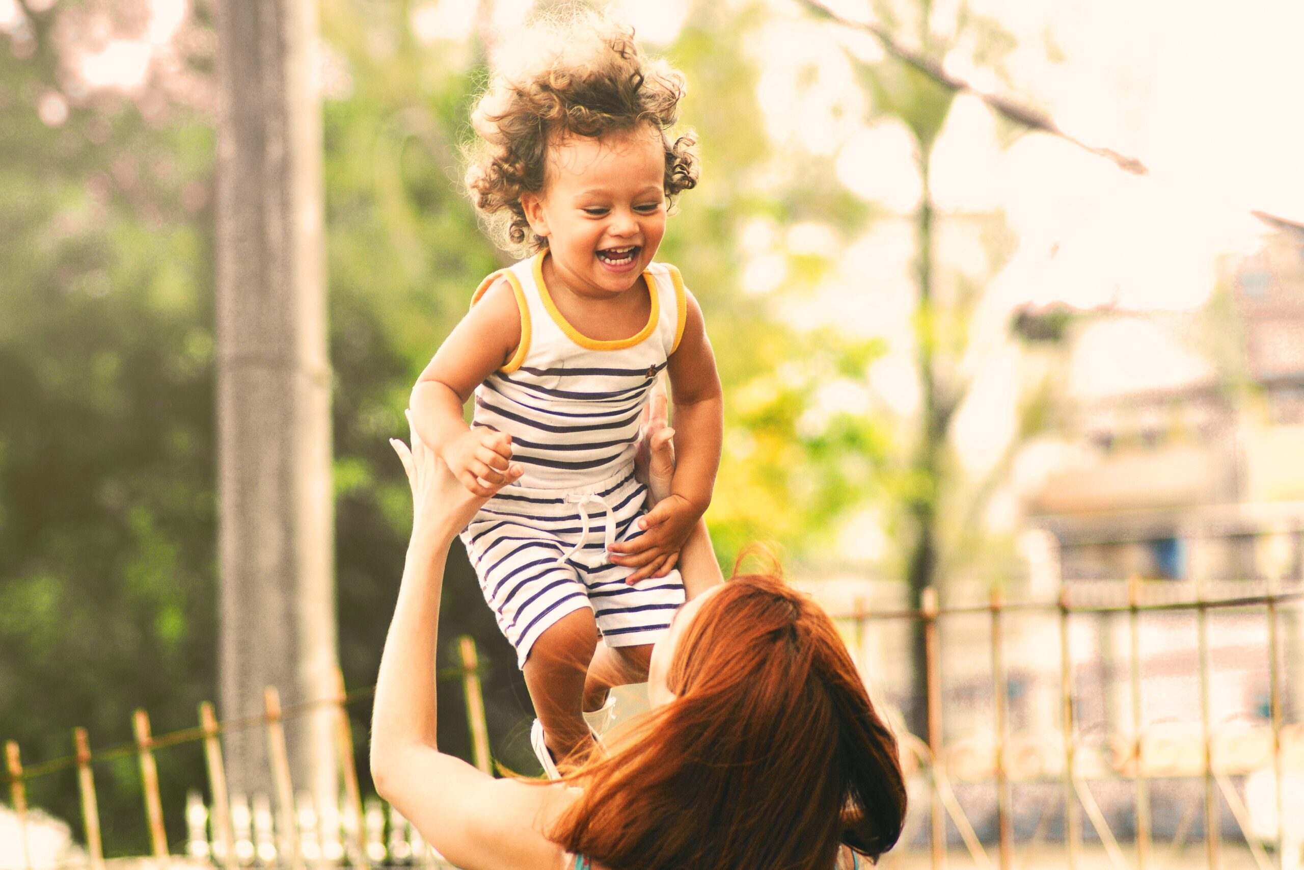 How long does it take to become a foster carer?
Foster carer playing outside with young boy.