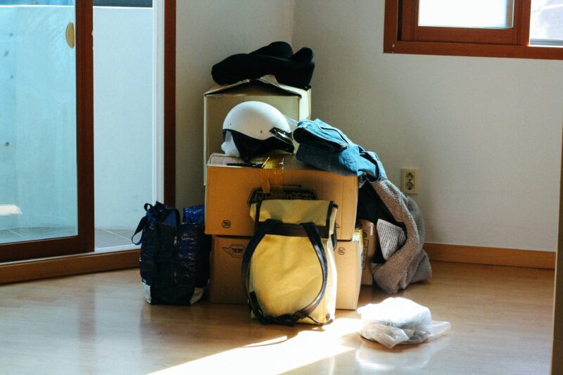 Bags and boxes in corner of house, representing Anglicare's homelessness services.