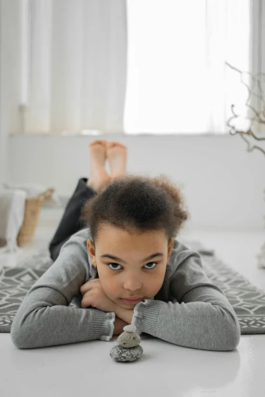 Child practising mindfulness and building resilience through calm reflection