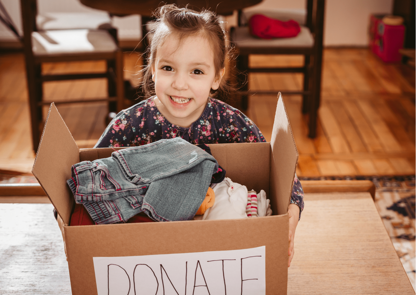4 ways you can make a difference to kids in care.
Image of a young girl holding up a donations box.