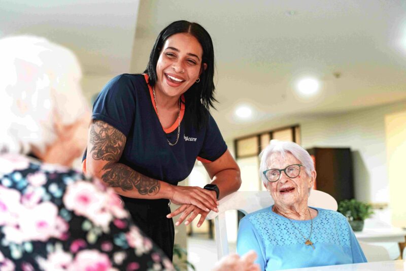 Anglicare worker chatting with residential aged care clients