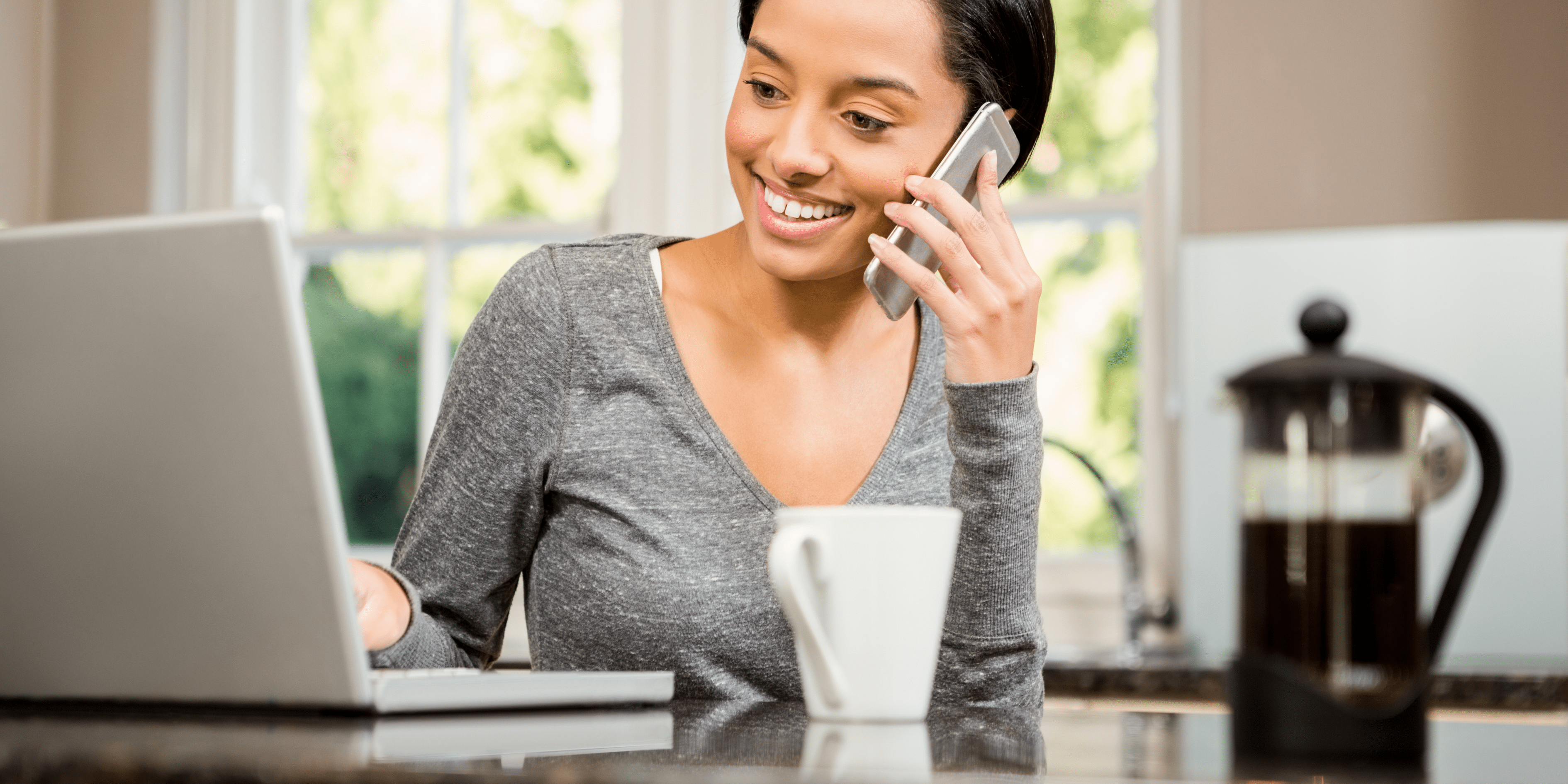 What does foster care training look like?
Woman sitting at computer doing training in her kitchen.