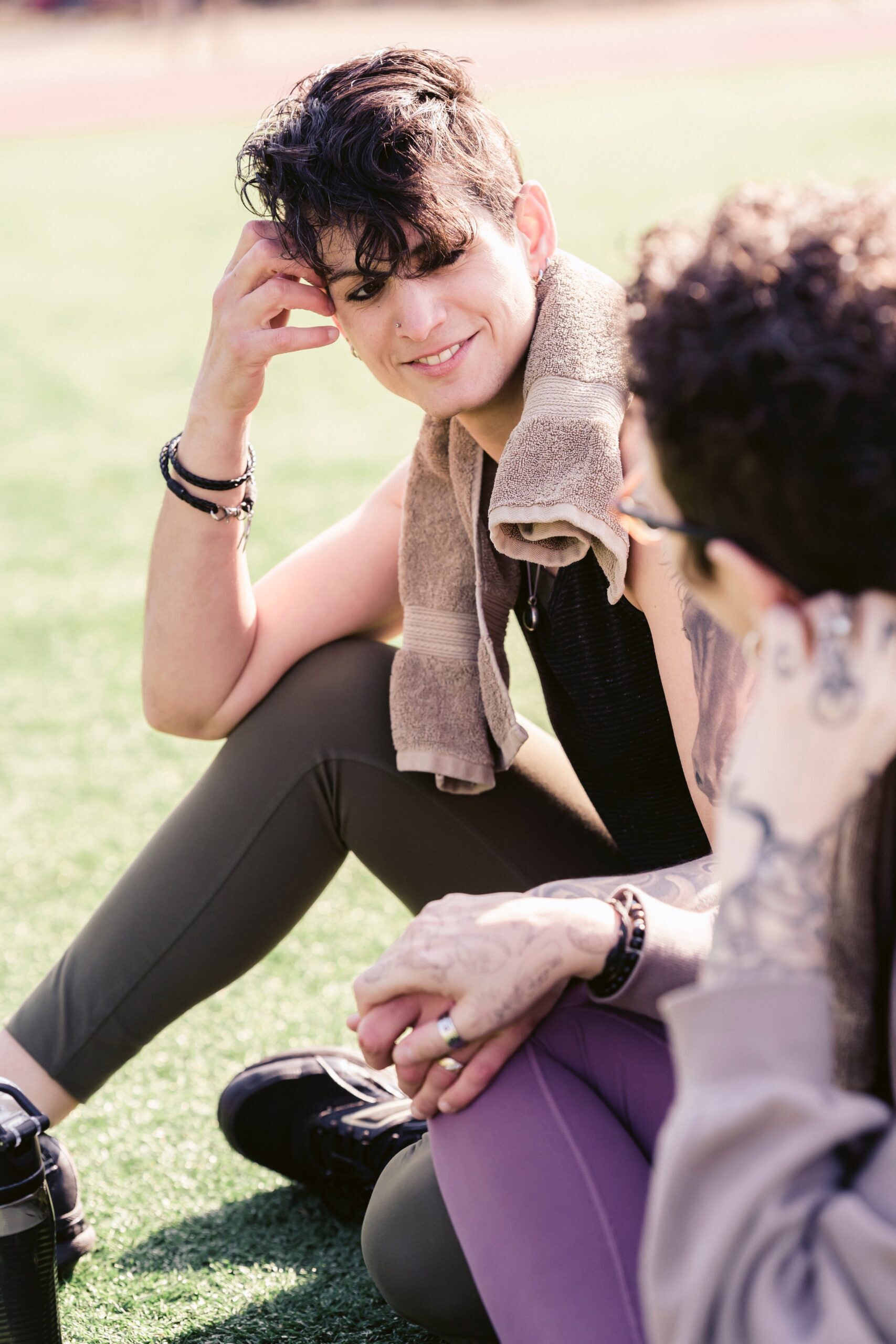 Effective Communication: couple chatting to each other in a park after a run