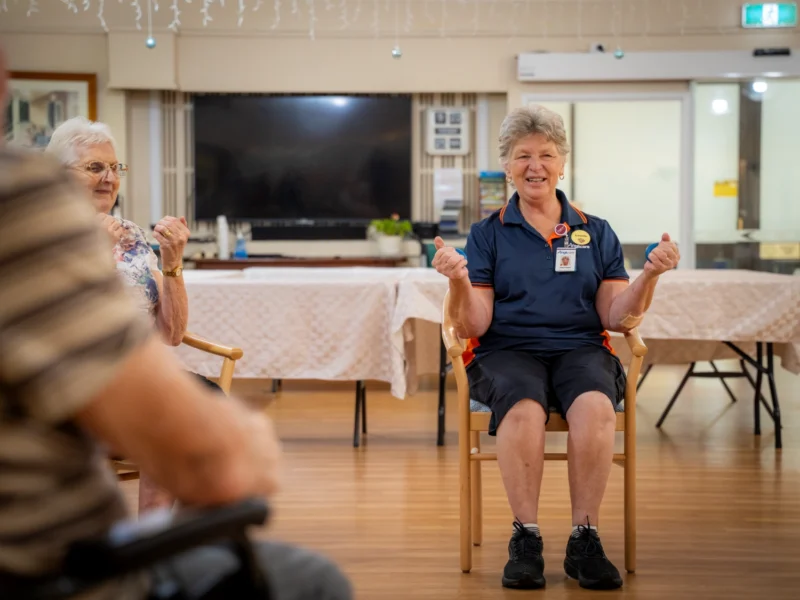 Anglicare worker demonstrating dementia care that supports physical health and comfort.
