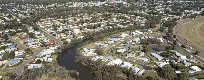 Birdseye view of a suburb with a river.