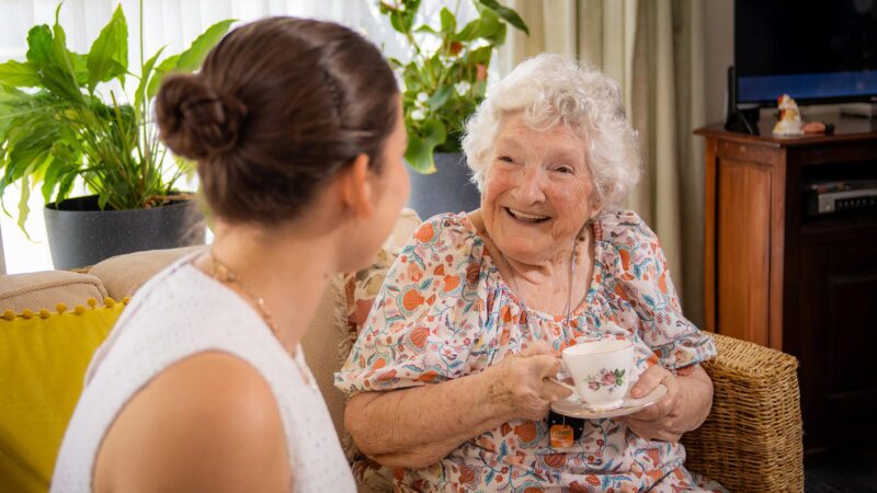 Elderly lady and young girl talking to each other from the Homeshare program.