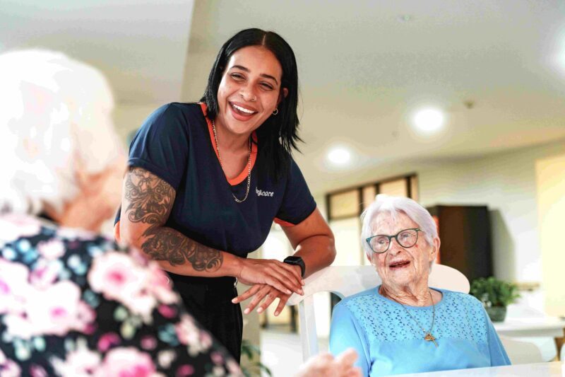 Anglicare worker chatting with residential aged care clients