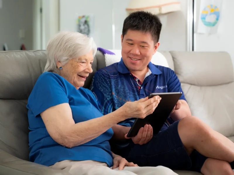 Anglicare worker helping client with Support at Home funding