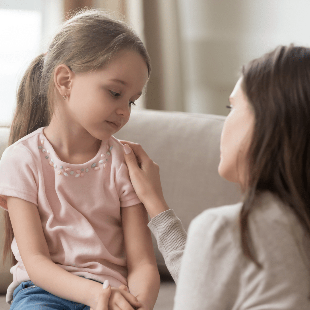 Mother consoling her young daughter after witnessing domestic and family violence