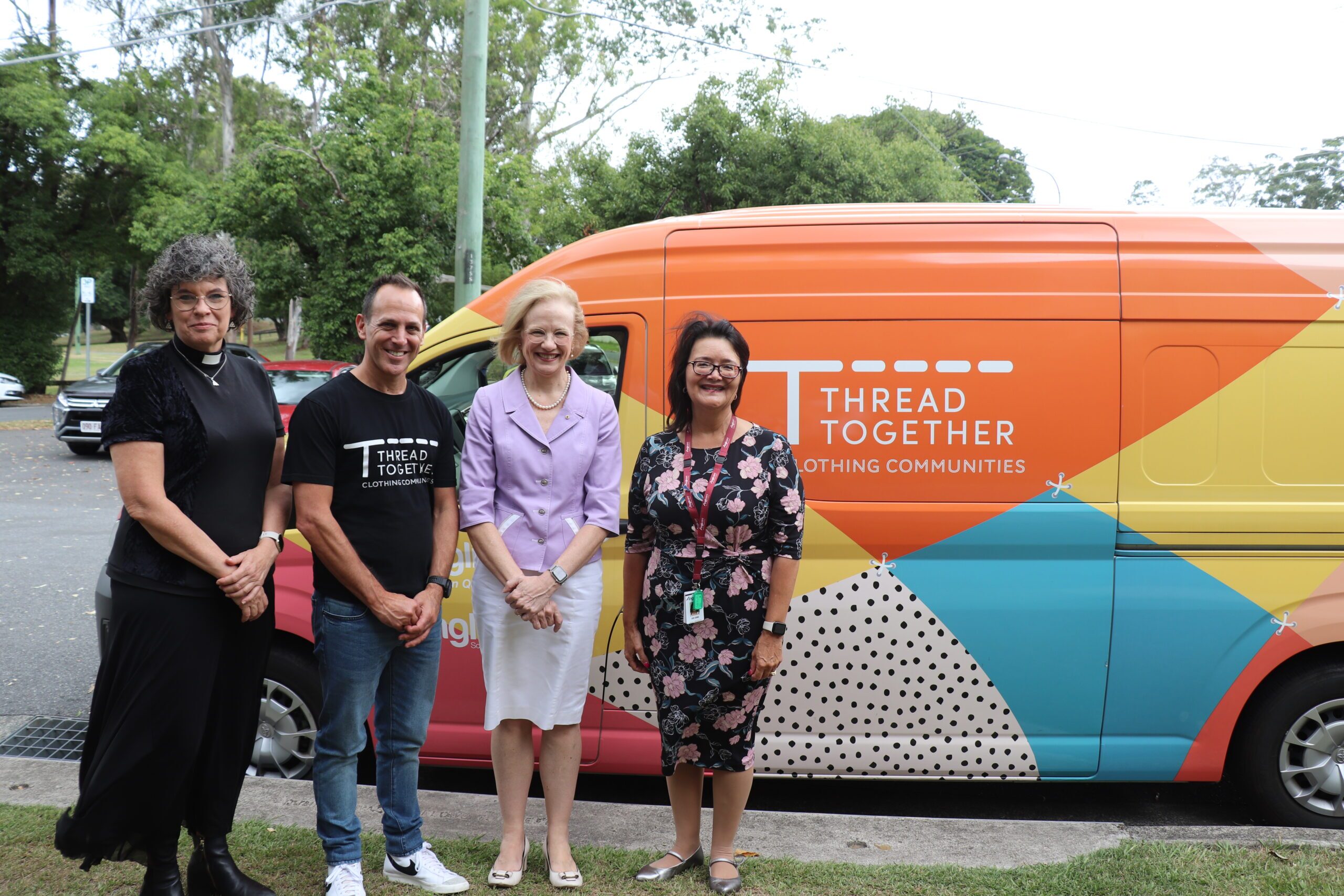 The Rev’d Sue Grimmett with Thread Together CEO Anthony Chesler, Her Excellency The Honourable Dr Jeannette Young AC PSM and Anglicare Southern Queensland’s Chief Executive Officer Sue Cooke with the Thread Together mobile wardrobe van