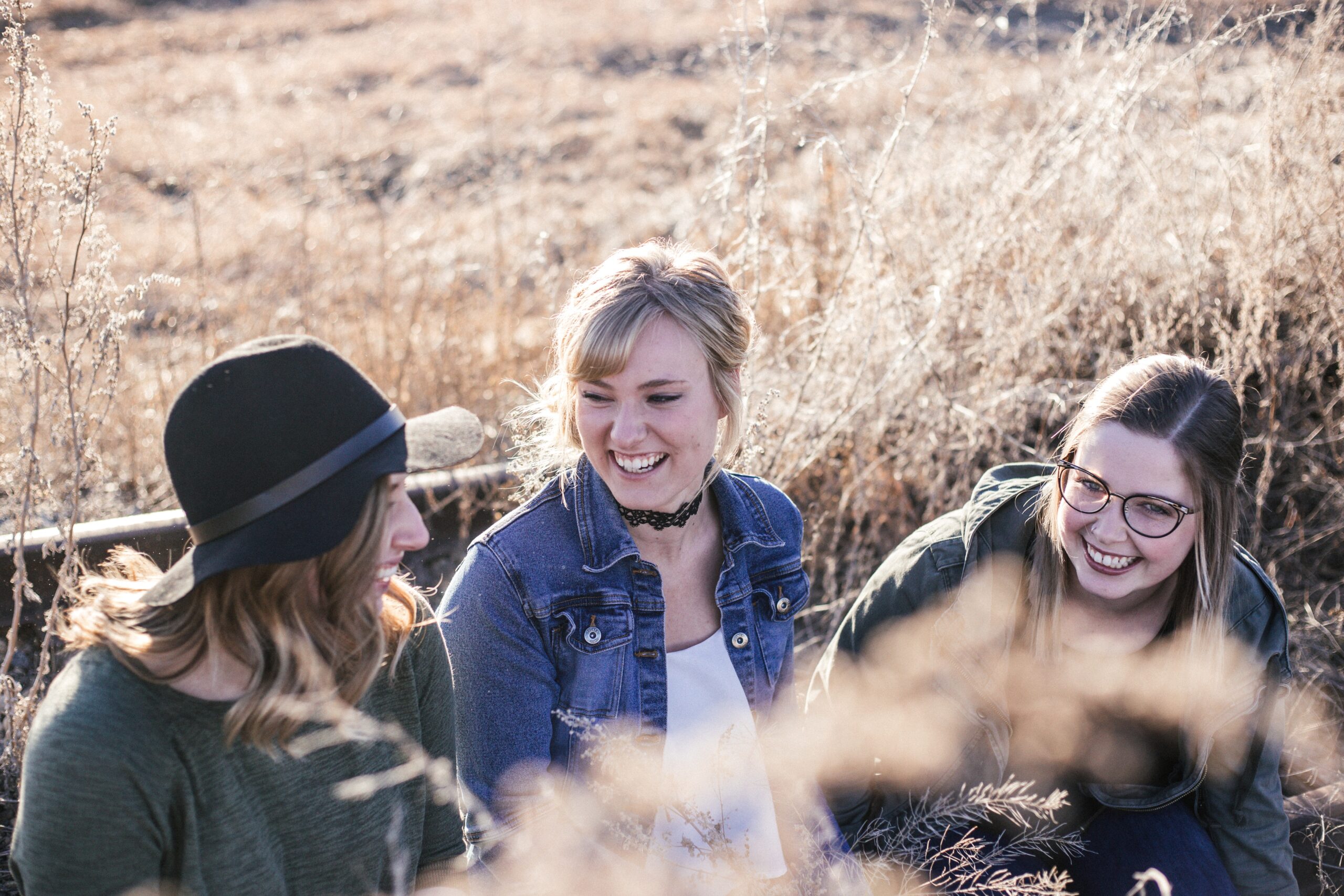 Julie and girls sitting on park bench
