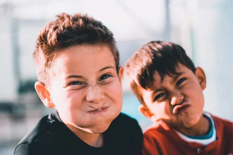 Young people in foster care enjoying outdoor play and interaction under Anglicare Southern Queensland support.