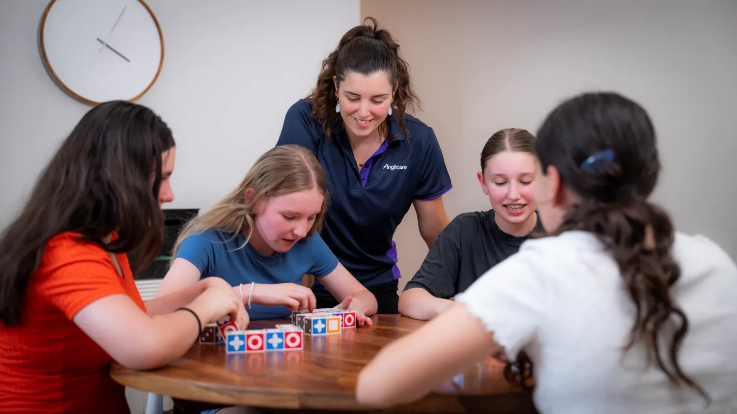 Out-of-home care practitioner doing an activity with children