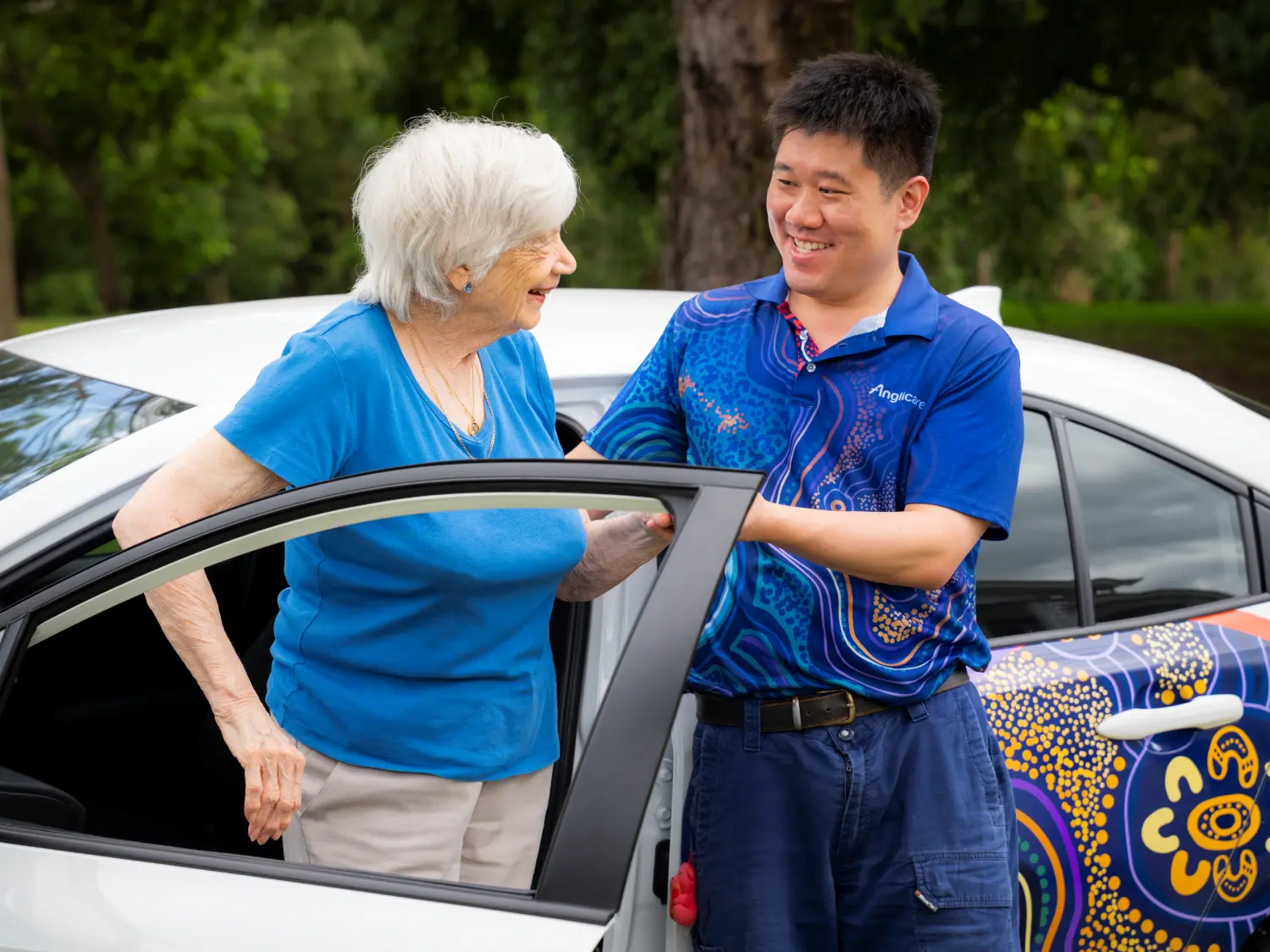 Home Care Worker helping client out of care