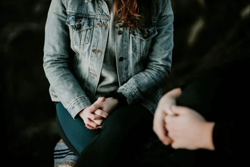 Two women having a conversation to understand trauma history