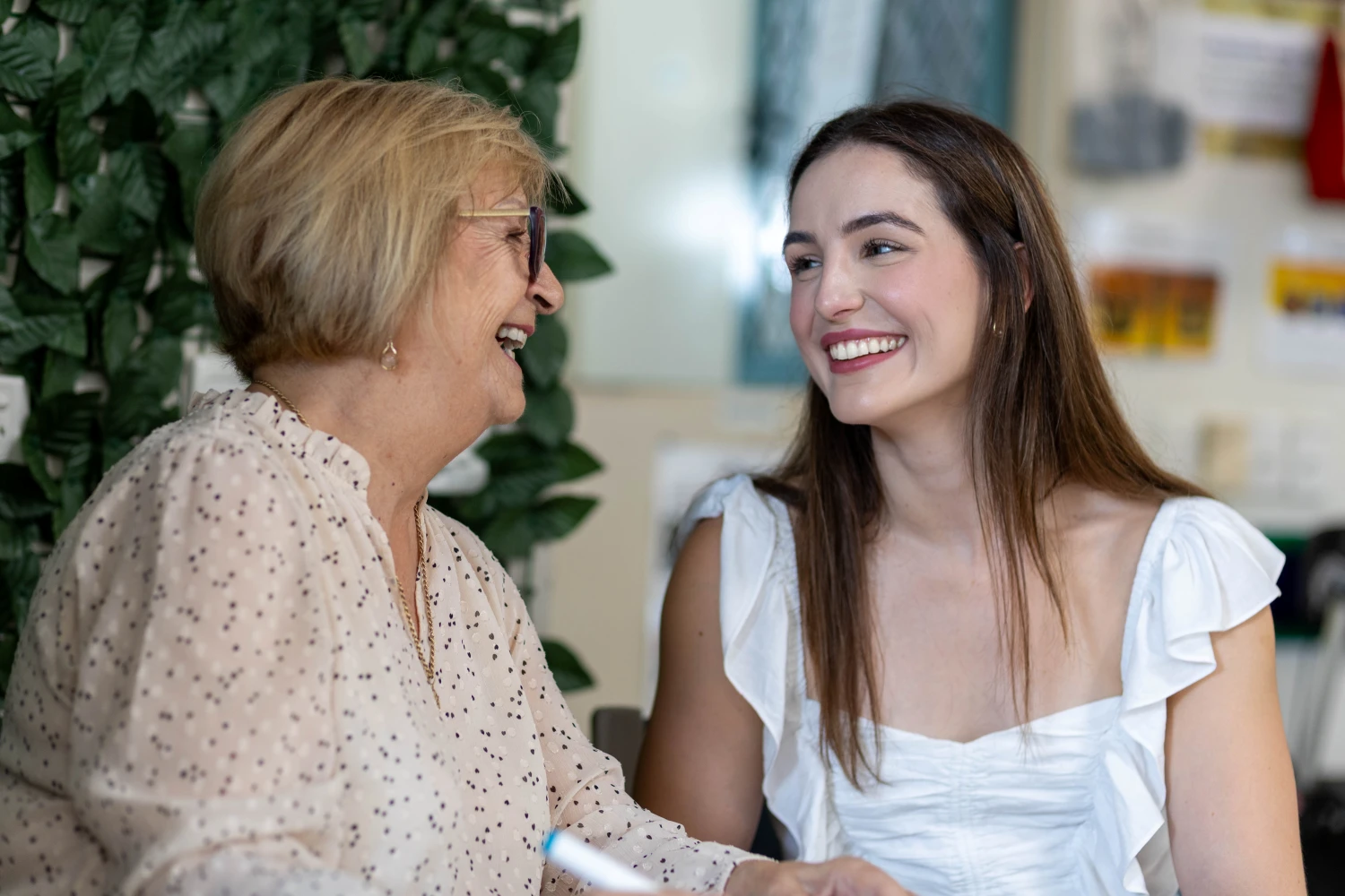 Anglicare dementia client Betty talking with granddaughter Kate at Anglicare respite centre.